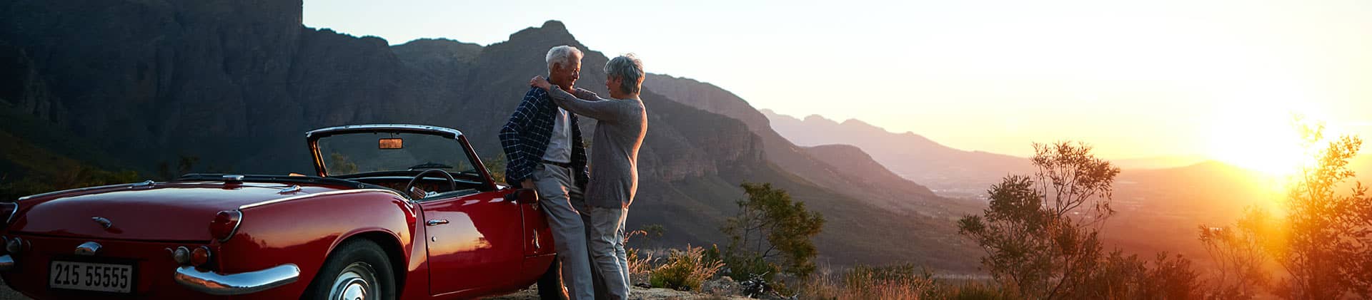 Elderly Couple Sports Car Mountains Products Variable Annuities VAROOM