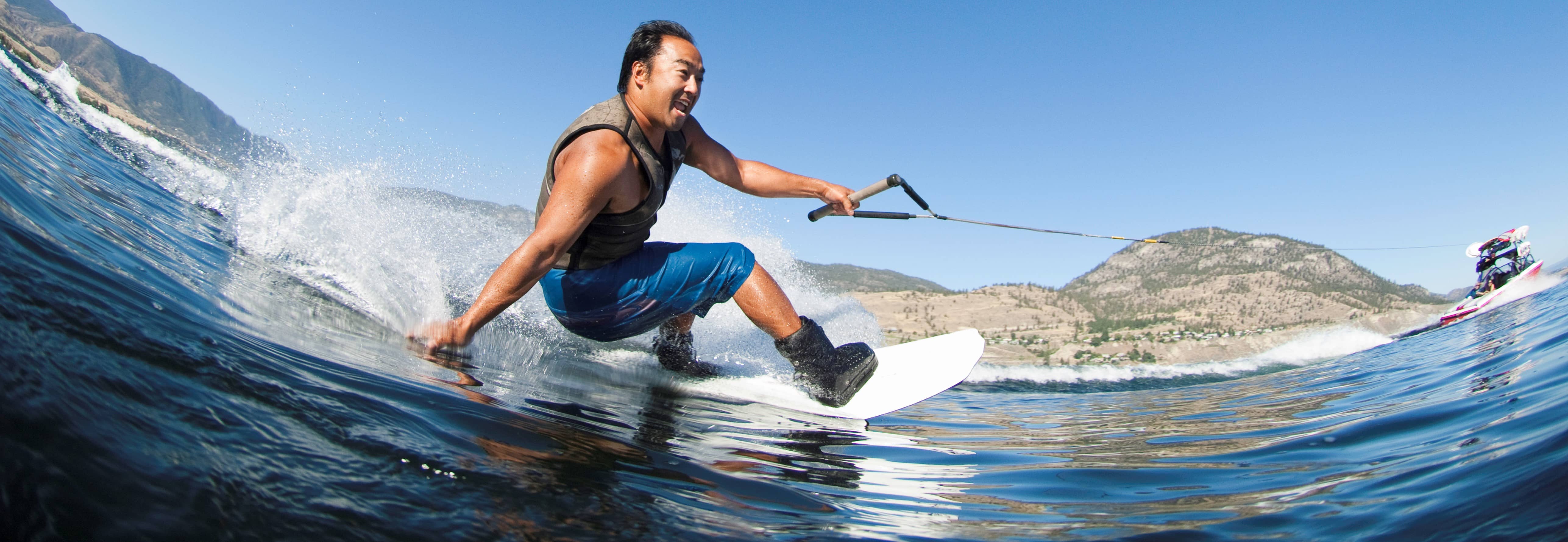 Man wakeboarding in the ocean.