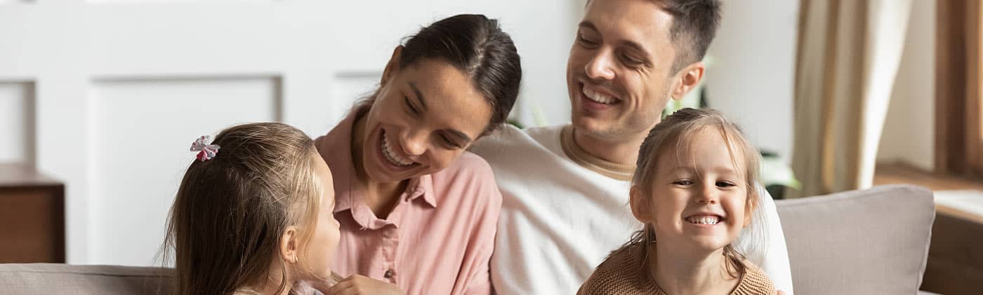 A family relaxes knowing they have enough life insurance 