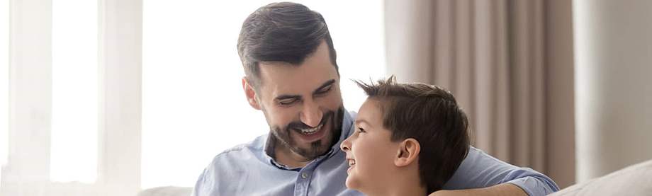 A father and son enjoy quality time after applying for life insurance as a stay-at-home parent 