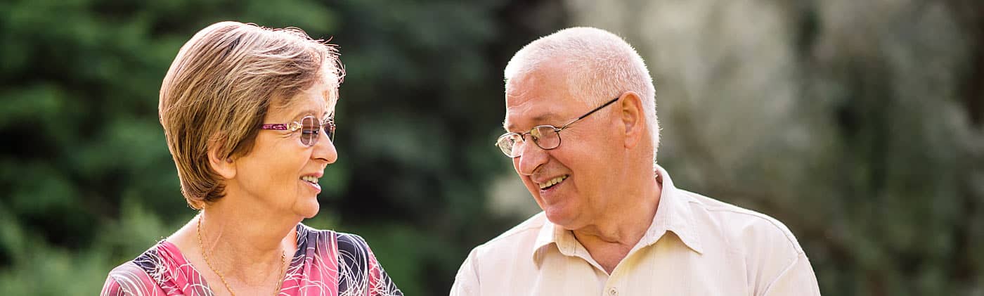 A mature couple checks the balance on their cash value life insurance 