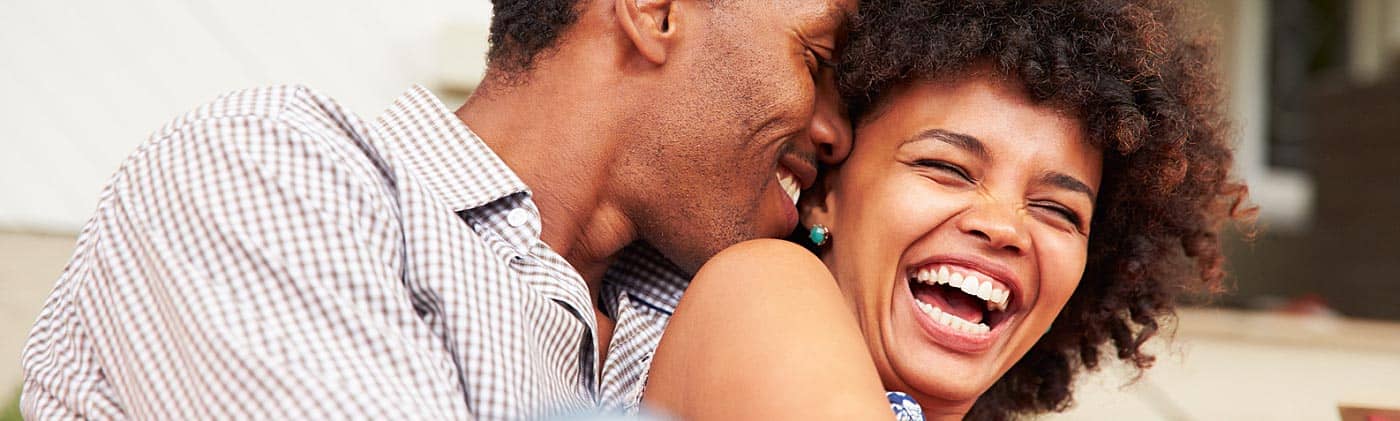 a-smiling-couple-spends-time-together-outside-money-management-for-couples-lg