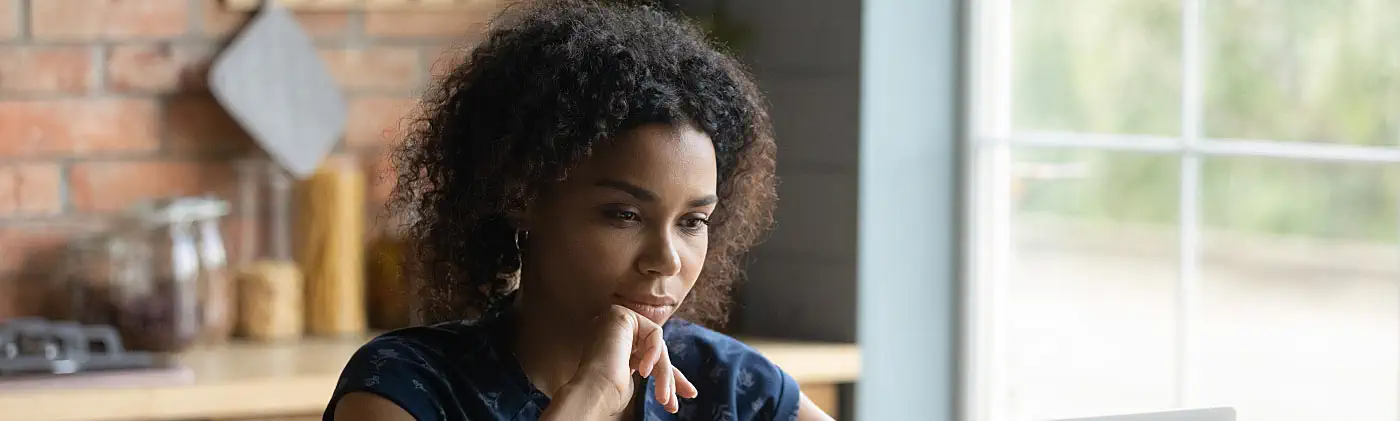 A young women researching how to increase 401(k) contributions incrementally 