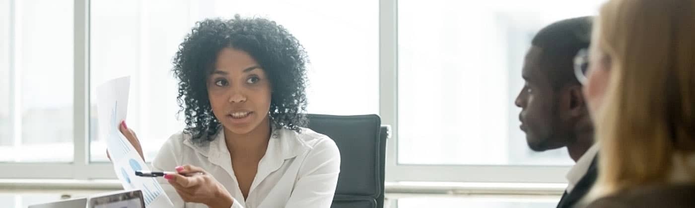 Advisor talking employees through finances as part of an employee financial wellness program 