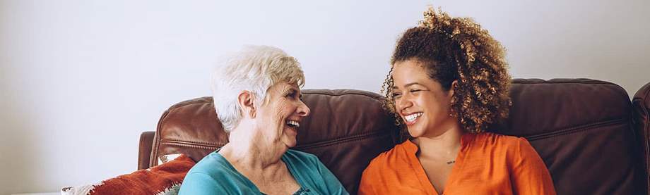 An elderly woman talking to her granddaughter about disability and retirement benefits 