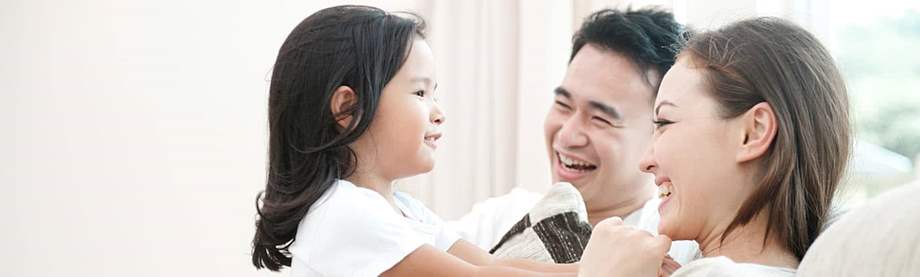 Asian parents and young daughter playing and talking about life insurance myths 