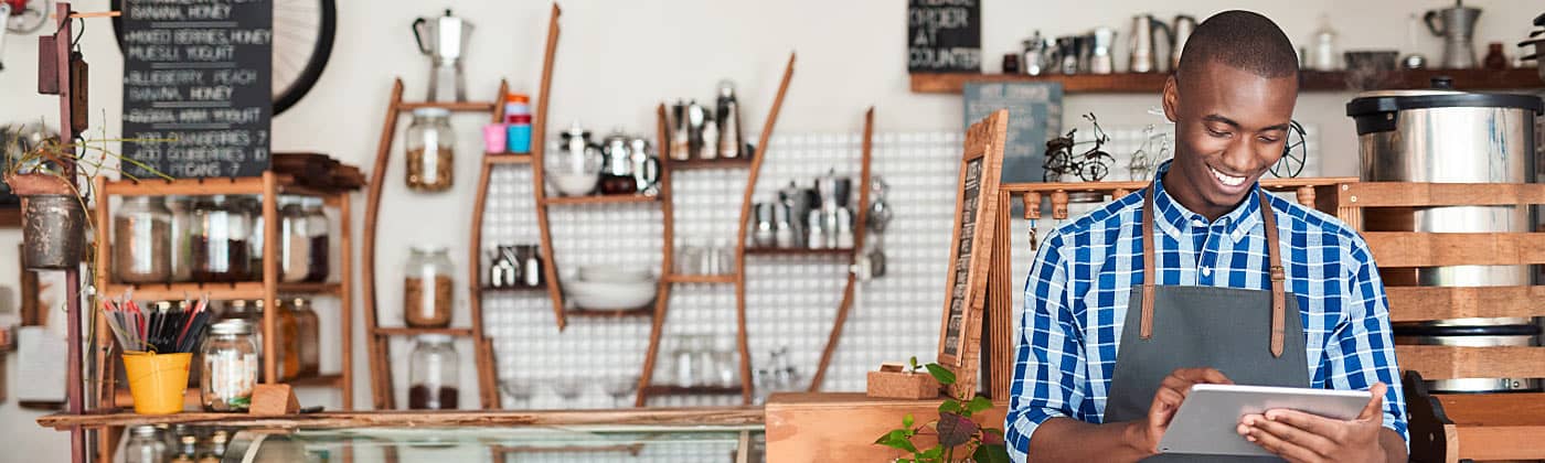 Cafe owner looking up "what is a SEP?" on his tablet 