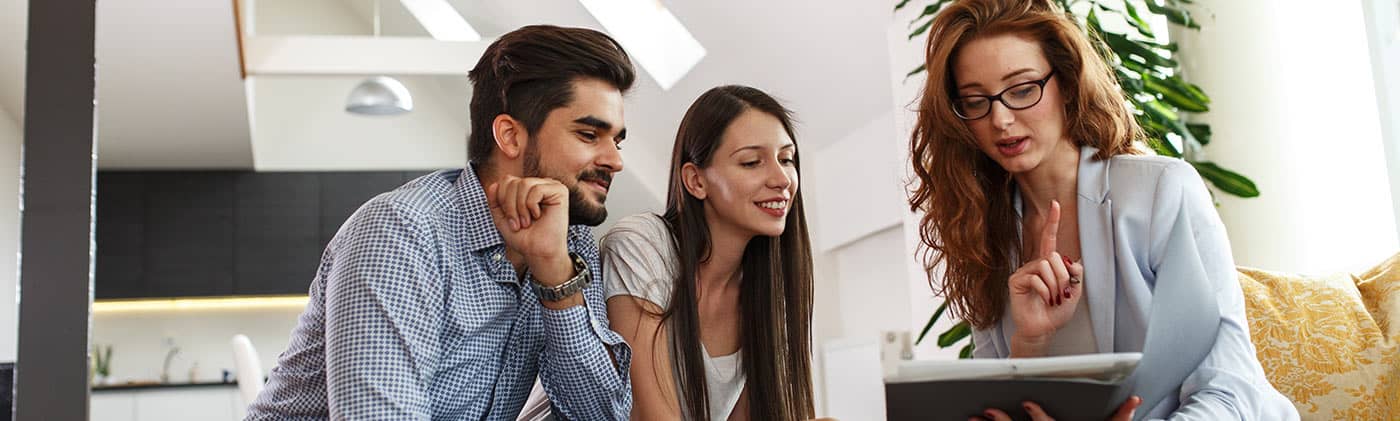 Financial Professional discussing finances with a young couple