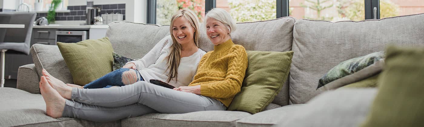 2 generations enjoying some time together on the couch