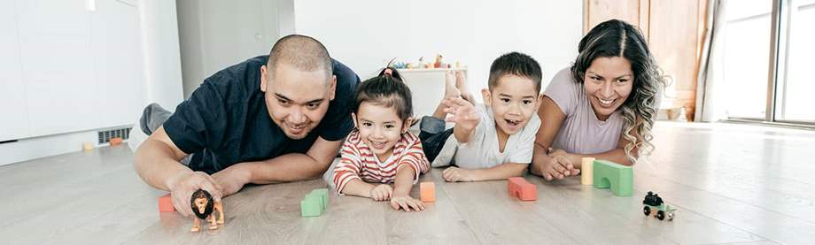 The whole family playing in the floor