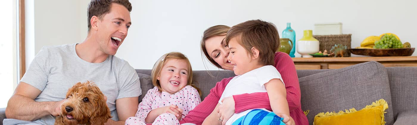The whole family on the couch enjoying some quality time