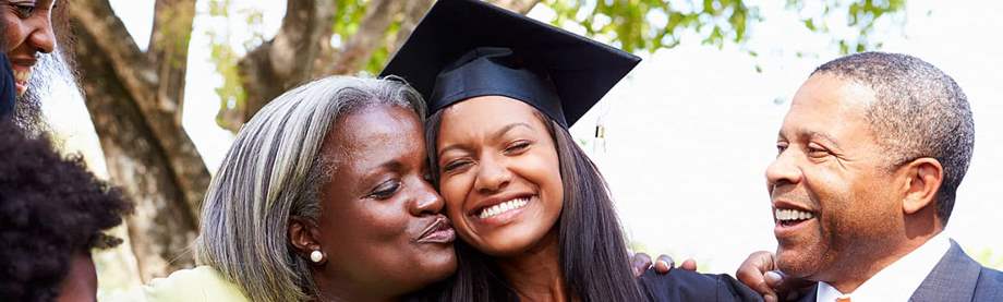 College graduate celebrating with her family after commencement: 529 college savings plan