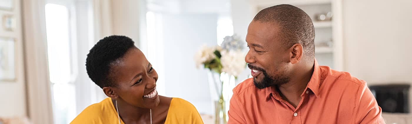 Couple discussing finances how tackle credit card debt greater financial health