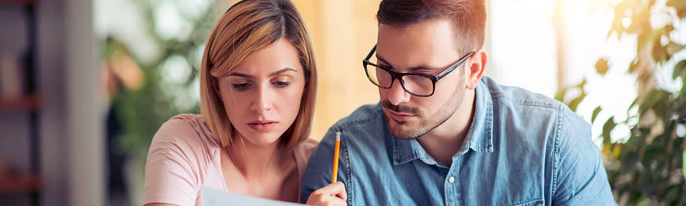 A couple does research to understand what life insurance covers