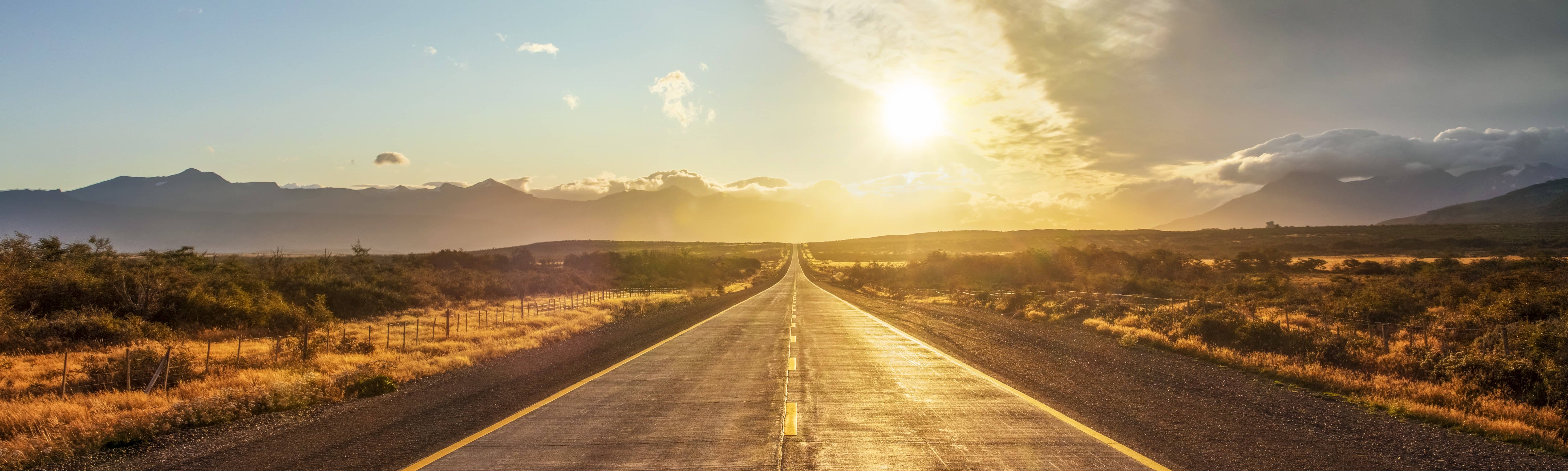 long road approaching sunset