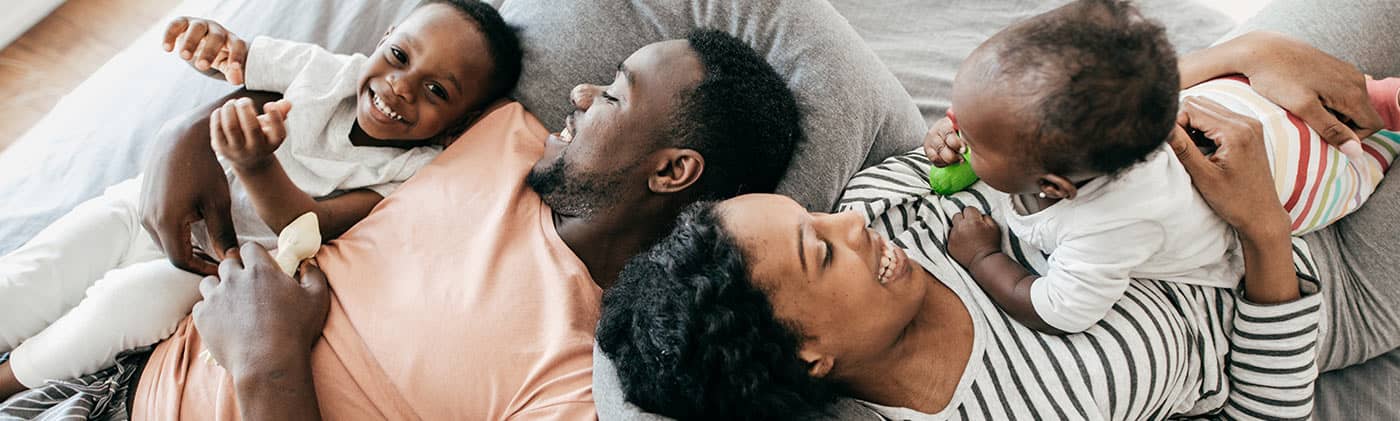 family together on bed