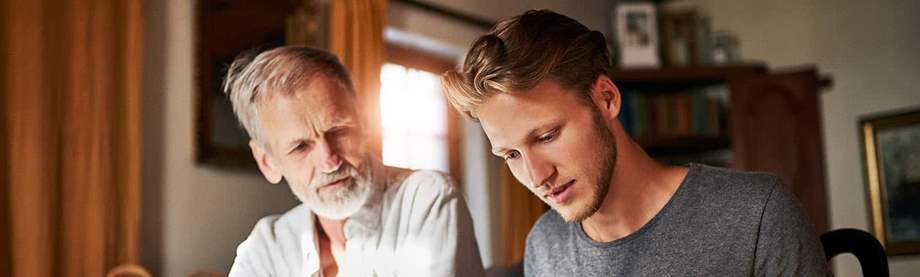 Father son helping protect parents from elder financial abuse and fraud