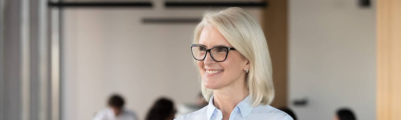 Female smiling after purchasing life insurance for business owners 
