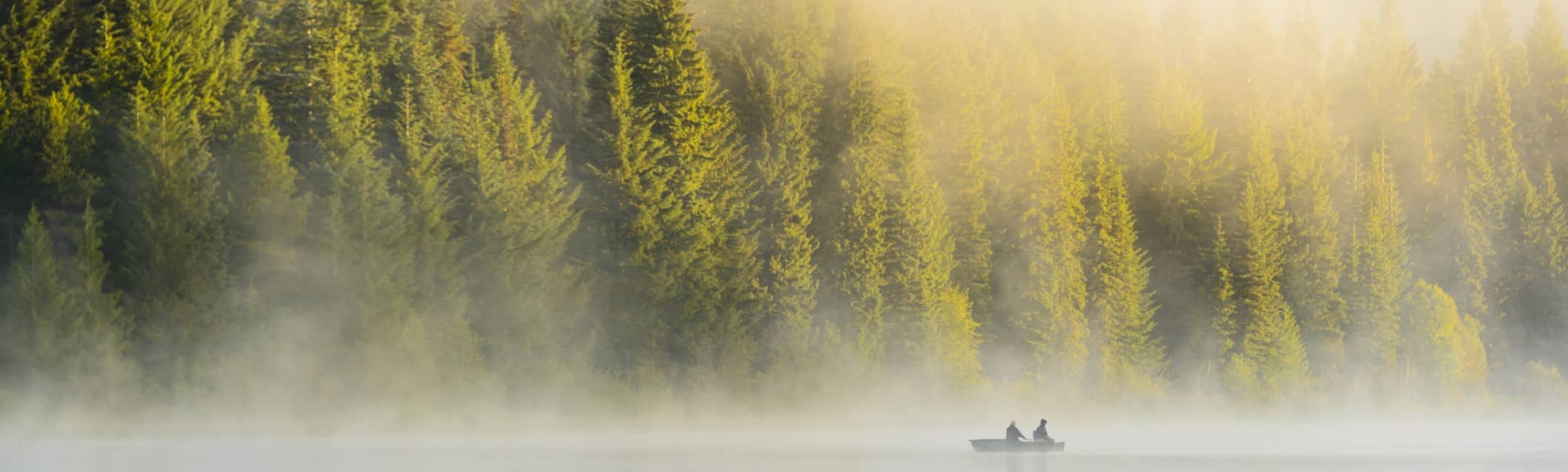 fishing boat with fog in the distance