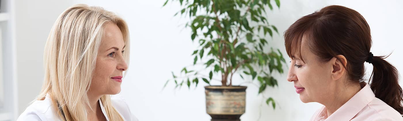 female doctor explains what to expect during the life insurance medical exam to her female patient