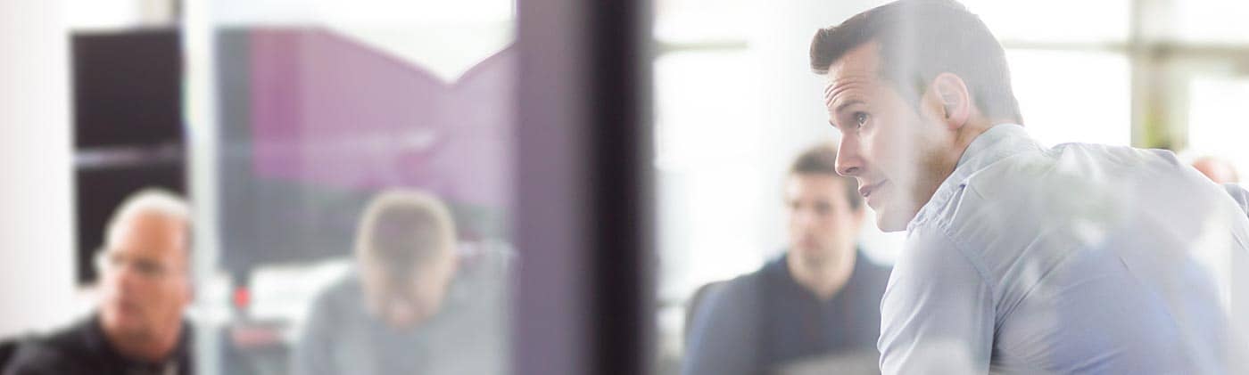 Group of middle-aged executives in a modern office: career change