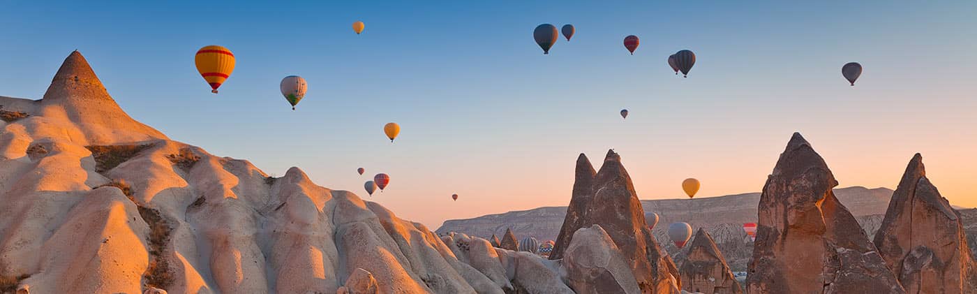 Hot air balloon over valley