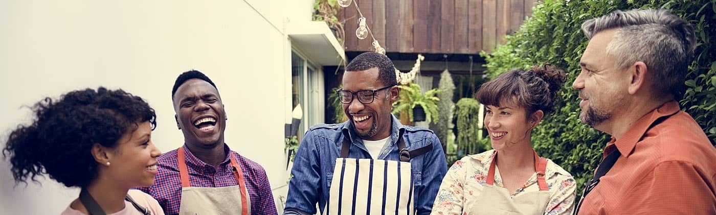 Group of friends discussing how to outsource small business employee benefits