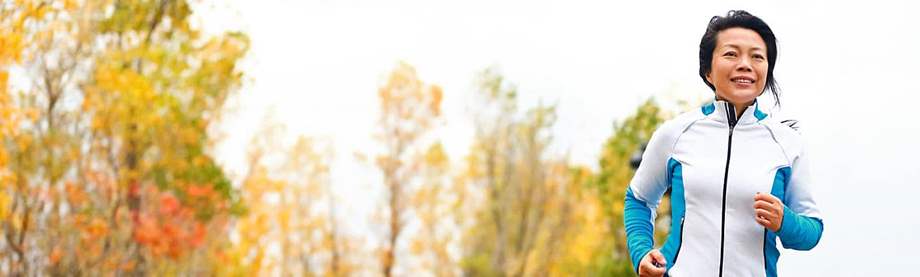 How to start saving for retirement in your 50s, like this mature woman pictured jogging in the fall