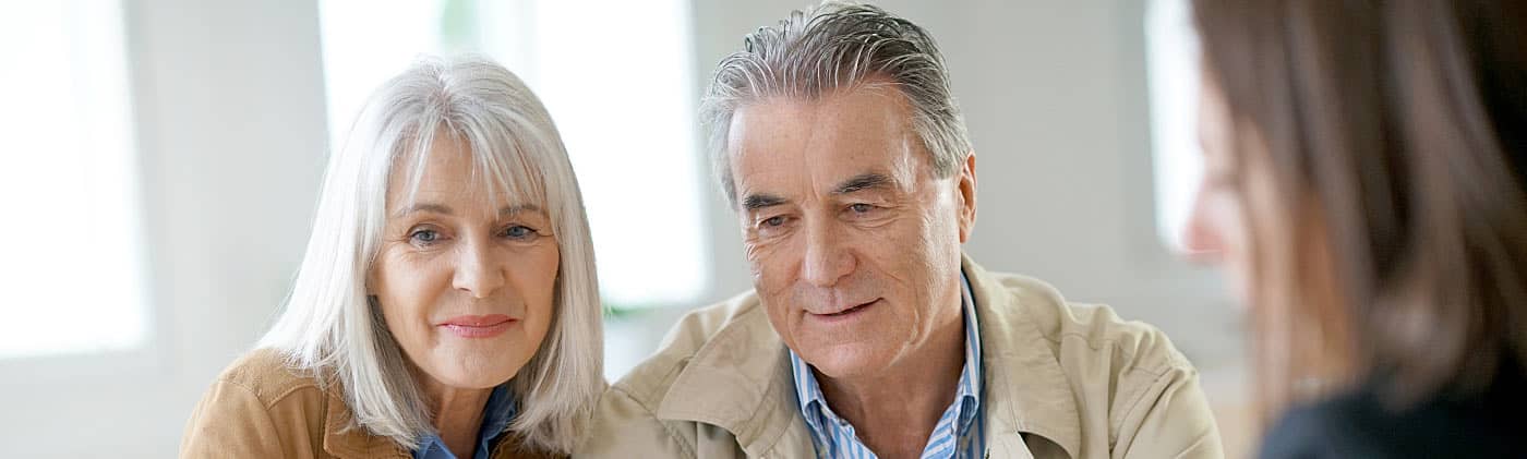 Husband and wife meeting to discuss downsizing your home for retirement 