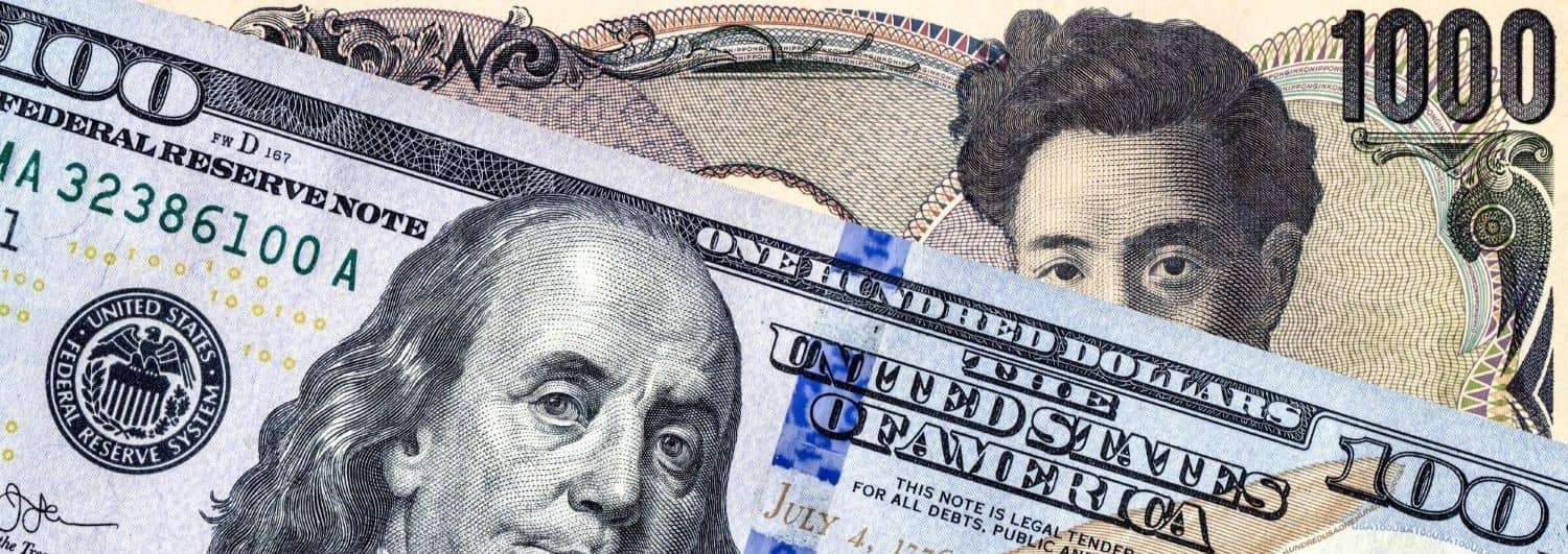 Japanese yen banknote and american dollar.