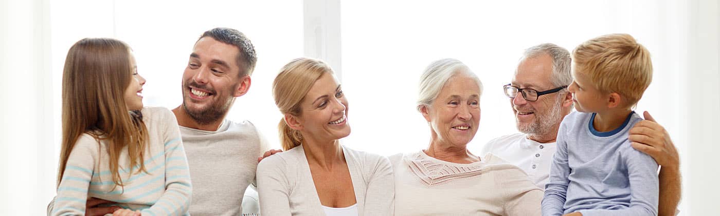 Large family sitting on a couch and discussing what happens if i die without a will 