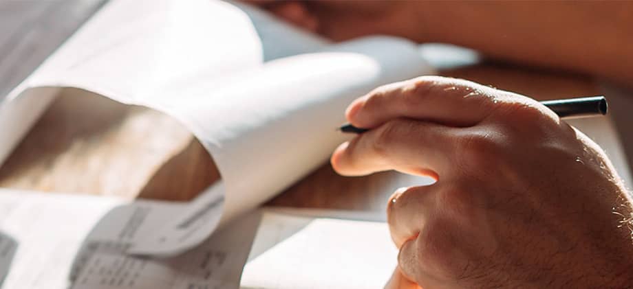 Reviewing bills and receipts with a pen