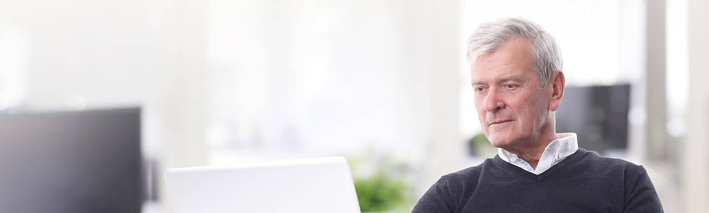 Man retiring from work and sitting at his desk 