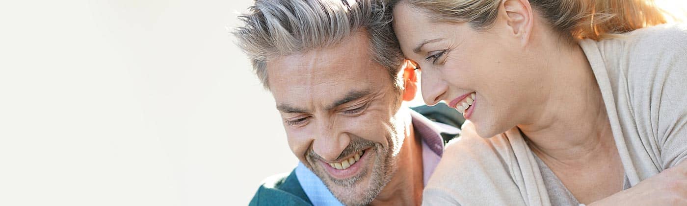 Mature couple goes for a hike in the mountains: empty nesters