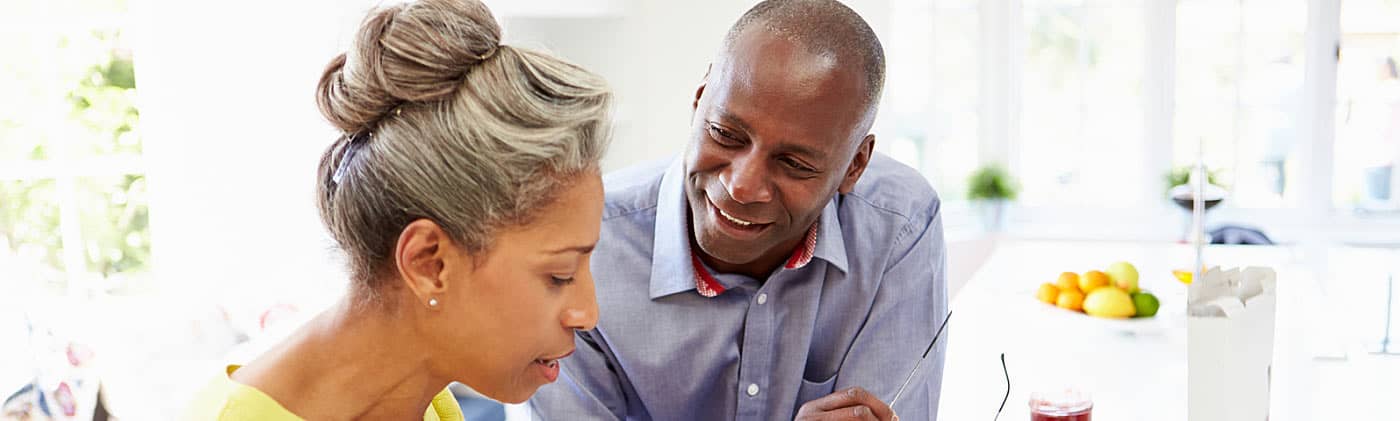 Middle-aged man and woman discussing the question of life insurance for your spouse at home 