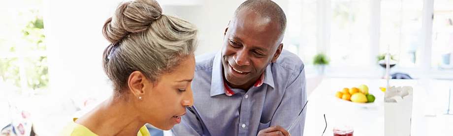 Middle-aged man and woman discussing the question of life insurance for your spouse at home