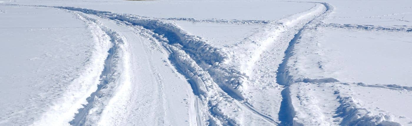 Snowmobile tracks in fresh snow.
