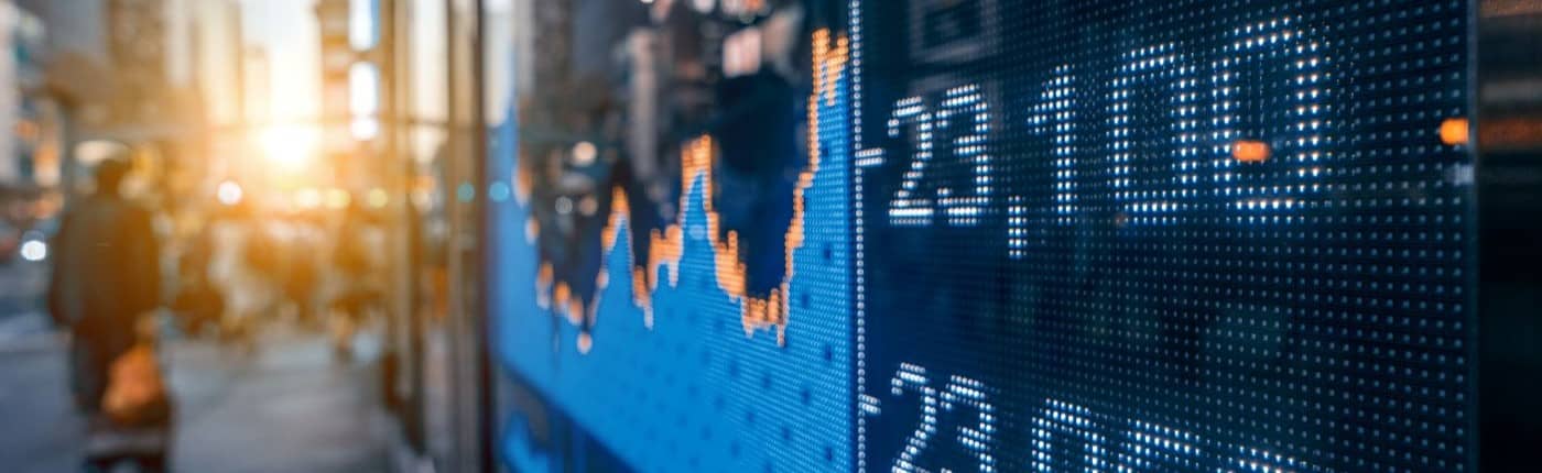 Positive financial expectations concept. Financial stock exchange market display screen board on the street.