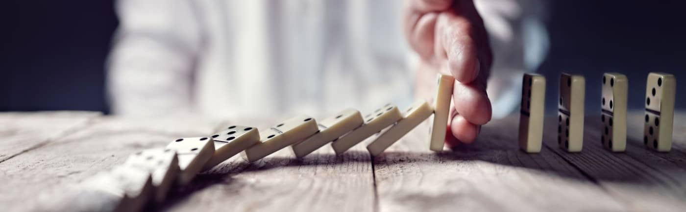 Stopping the domino effect concept.