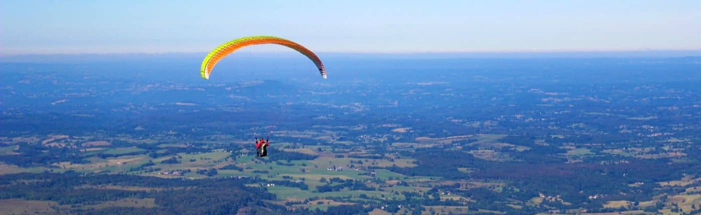 Parachutist in air. Soft-landing concept.