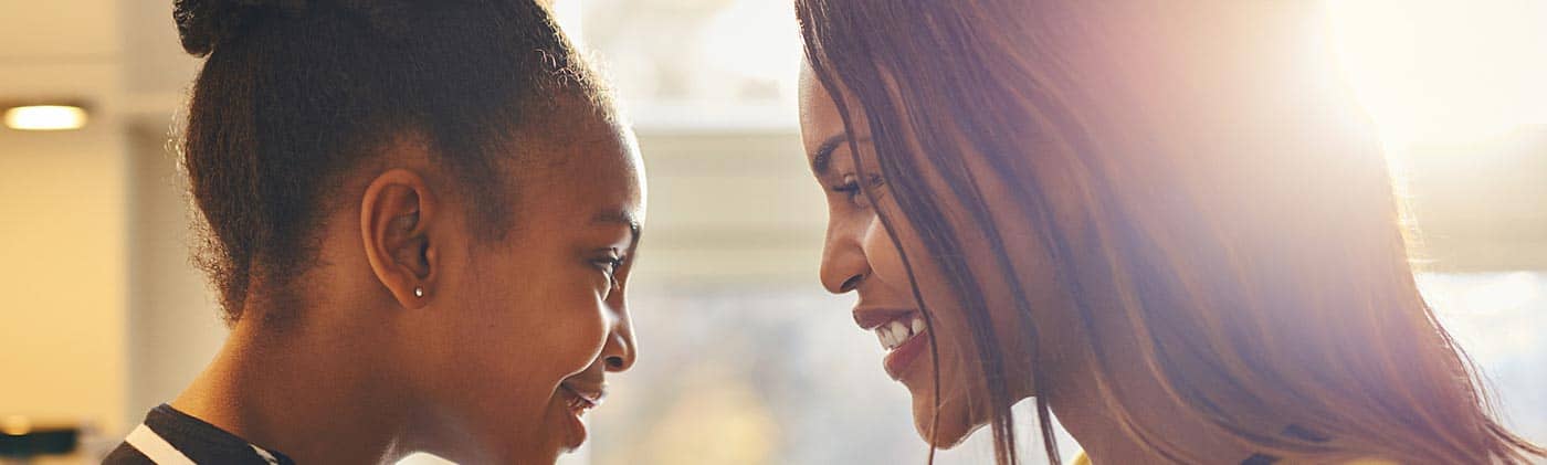mother and daughter at home talking to each other plan for retirement