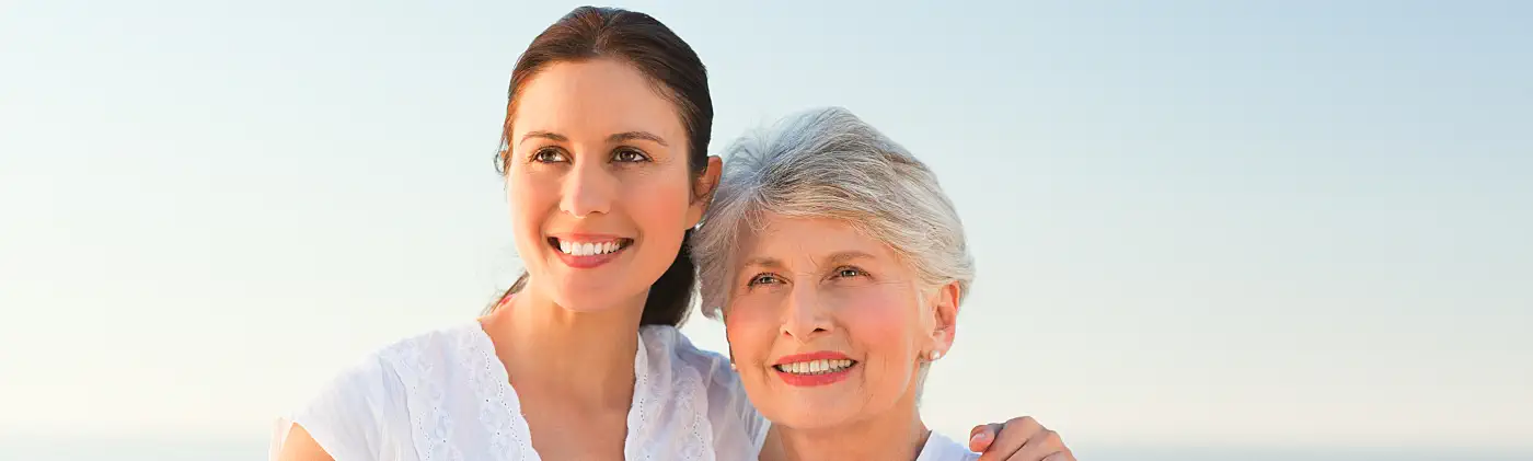 Mother and daughter at the beach discussing what to do if you inherit an IRA 