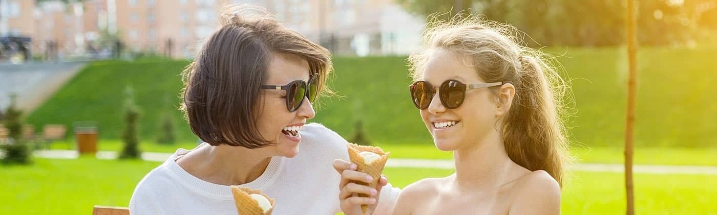 mother who's considering setting up a 529 plan spending time with her happy teenage daughter