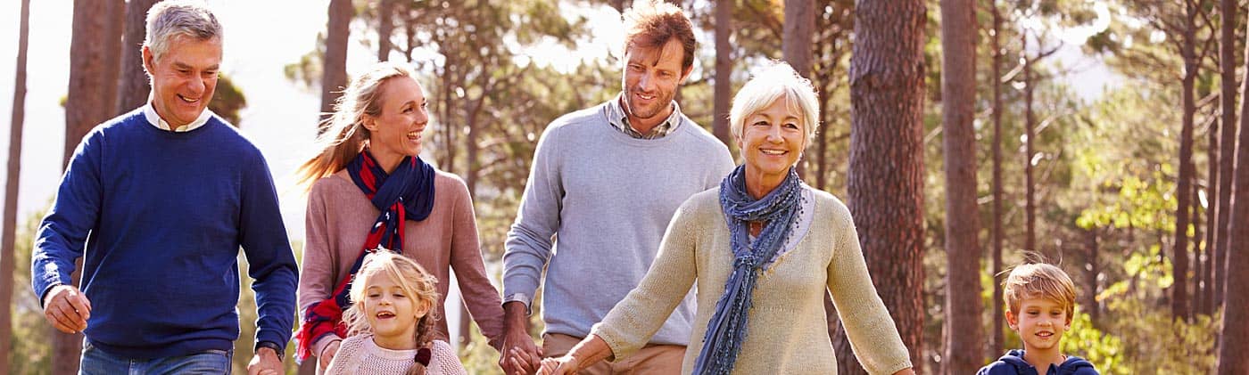 Multigenerational family enjoys a walk on a sunny fall day: retirement mistakes