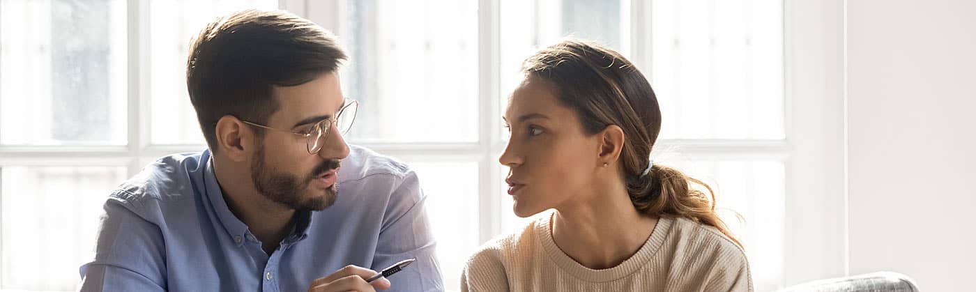 A smiling man on a phone call discussing no medical exam life insurance