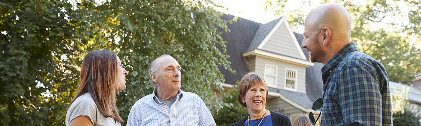 four neighbors of various ages eat at a block party and discuss when is a good time for opening an ira