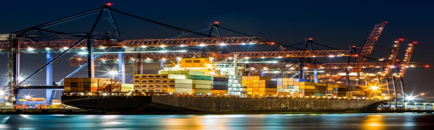 cargo ship at port at night