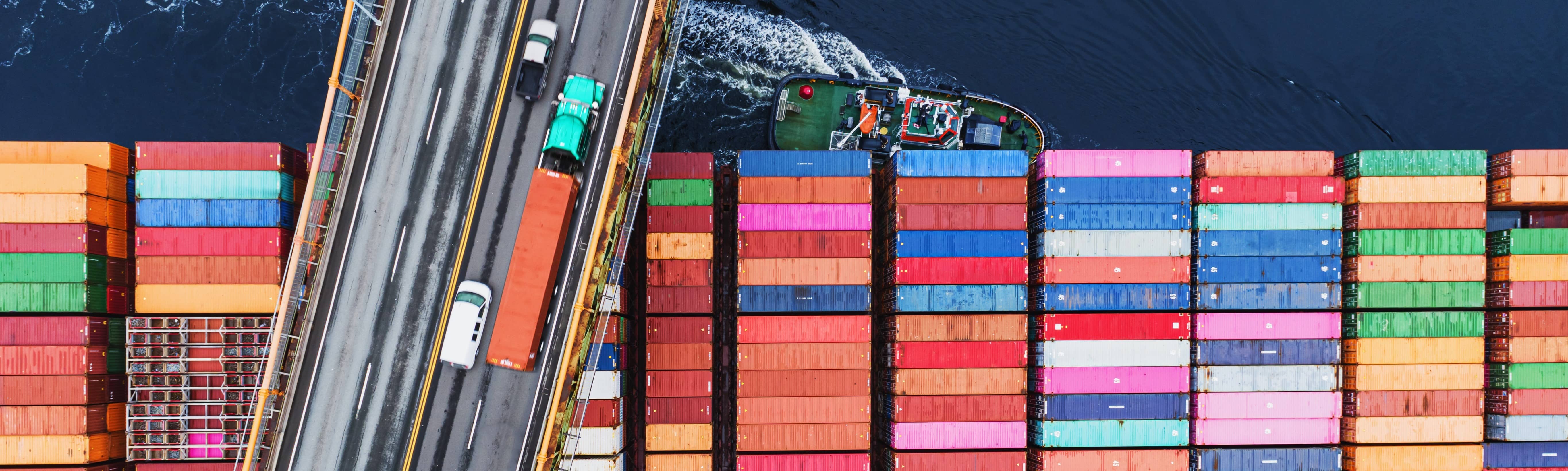 shipping container going under bridge
