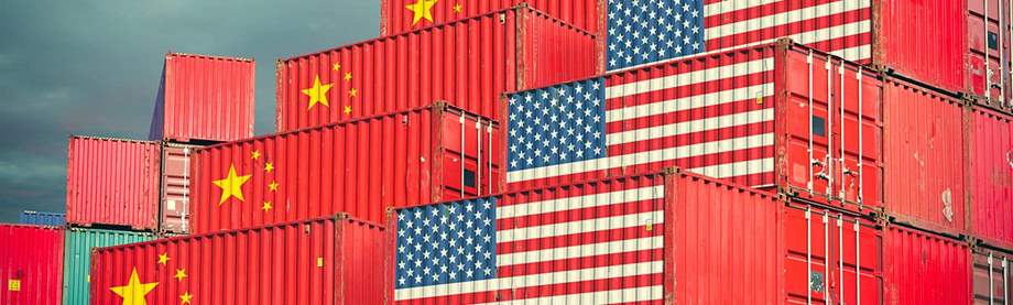 Shipping containers with US and China flags