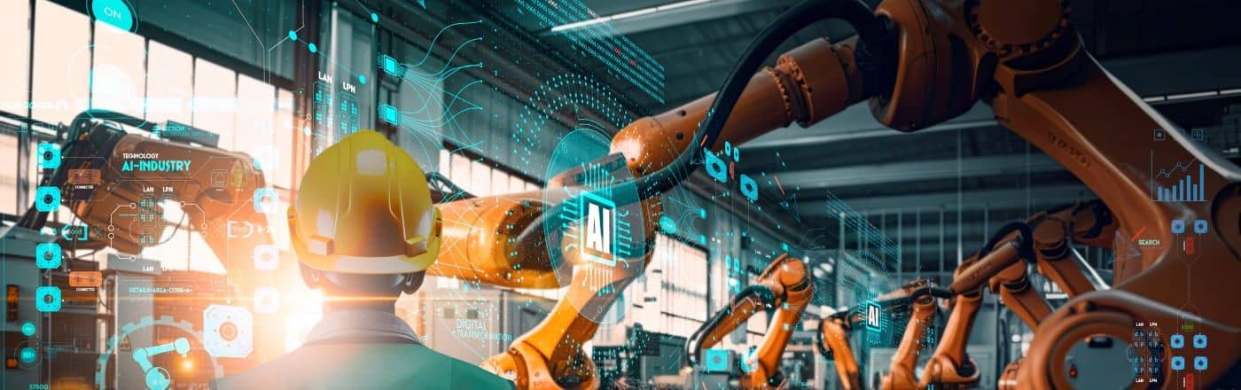 Industrial Engineer working with Ai automation robot arms machine in intelligent factory industrial on real time monitoring system software.